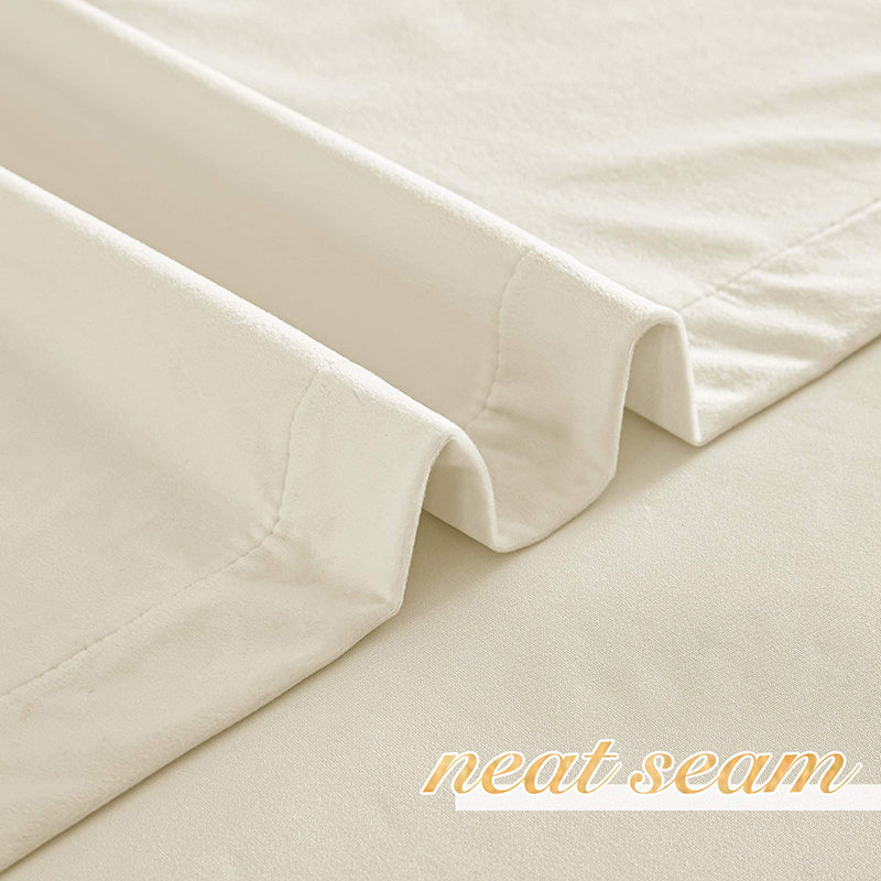 Close-up of light beige velvet rod pocket blackout curtain fabric, highlighting a neat, durable seam for privacy protection.