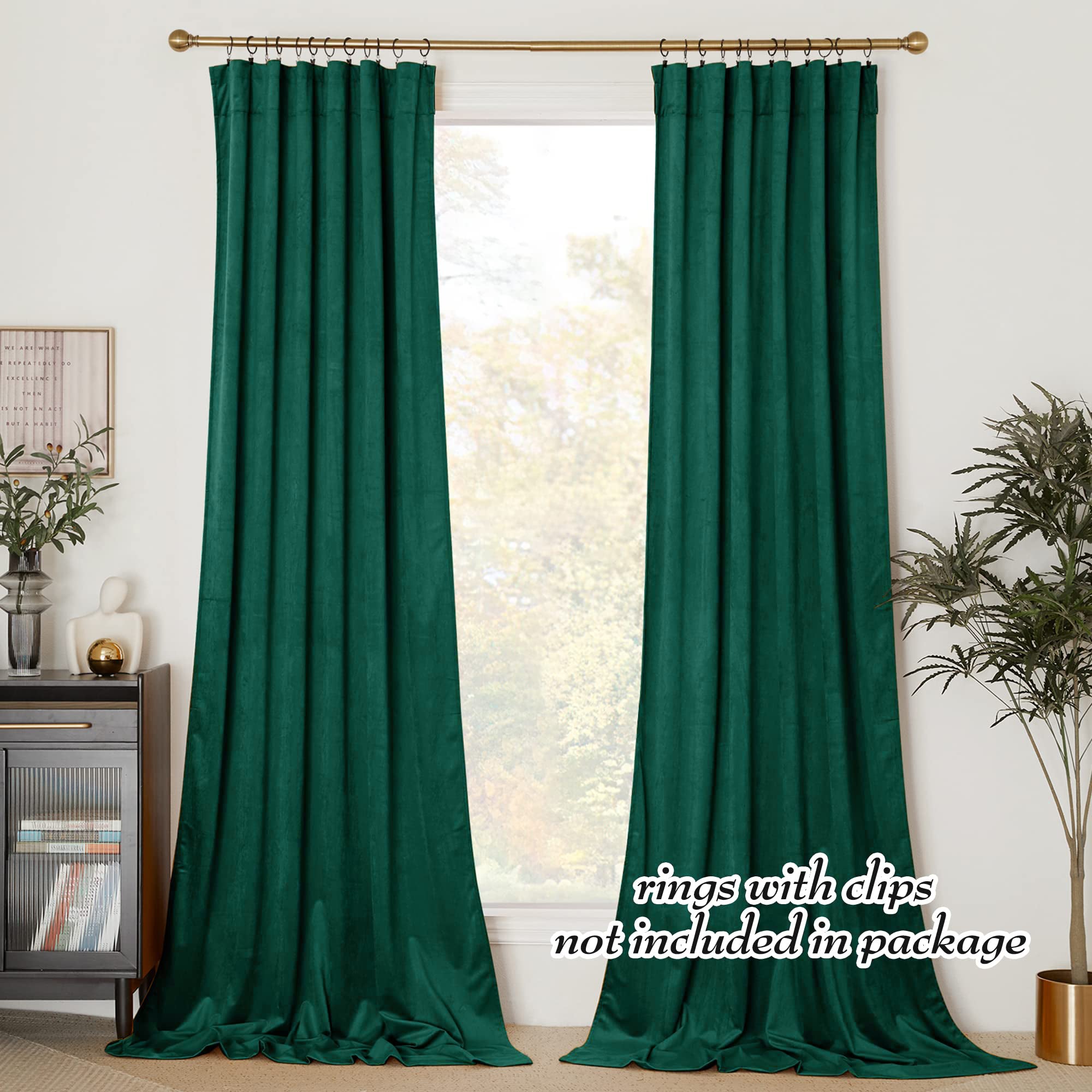Set of two emerald green velvet rod pocket blackout curtains, floor-length, providing privacy for living room or bedroom.