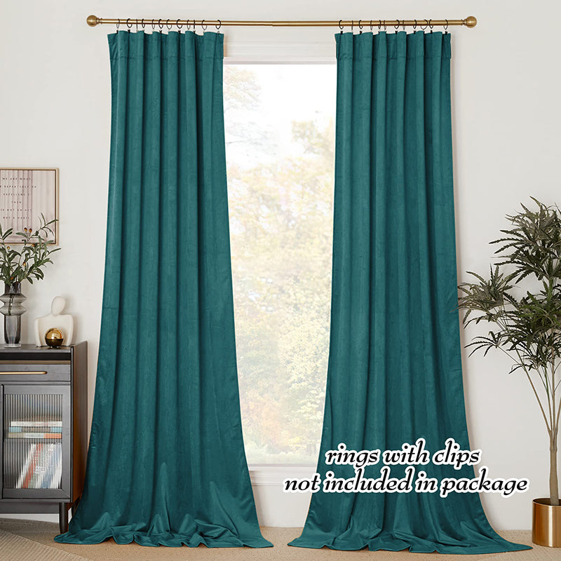Luxurious teal velvet rod pocket blackout curtains, a pair providing privacy protection for living room or bedroom.