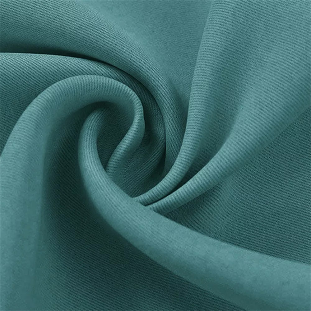Densely woven teal fabric detail of 4-layer anti-dust soundproof blackout curtains for living room or bedroom.