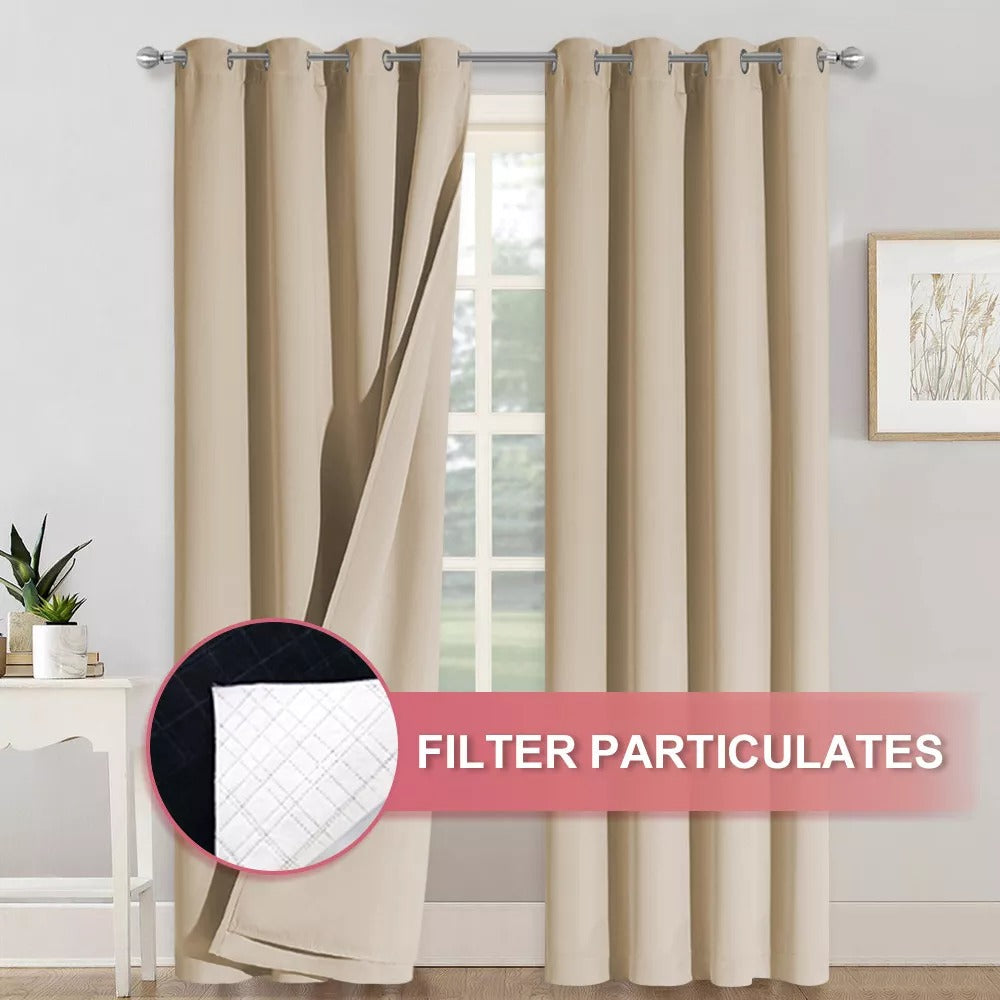 Beige 4-layer silver grommet blackout curtains, pulled back to show layered fabric filtering particulates for anti-dust & soundproofing.