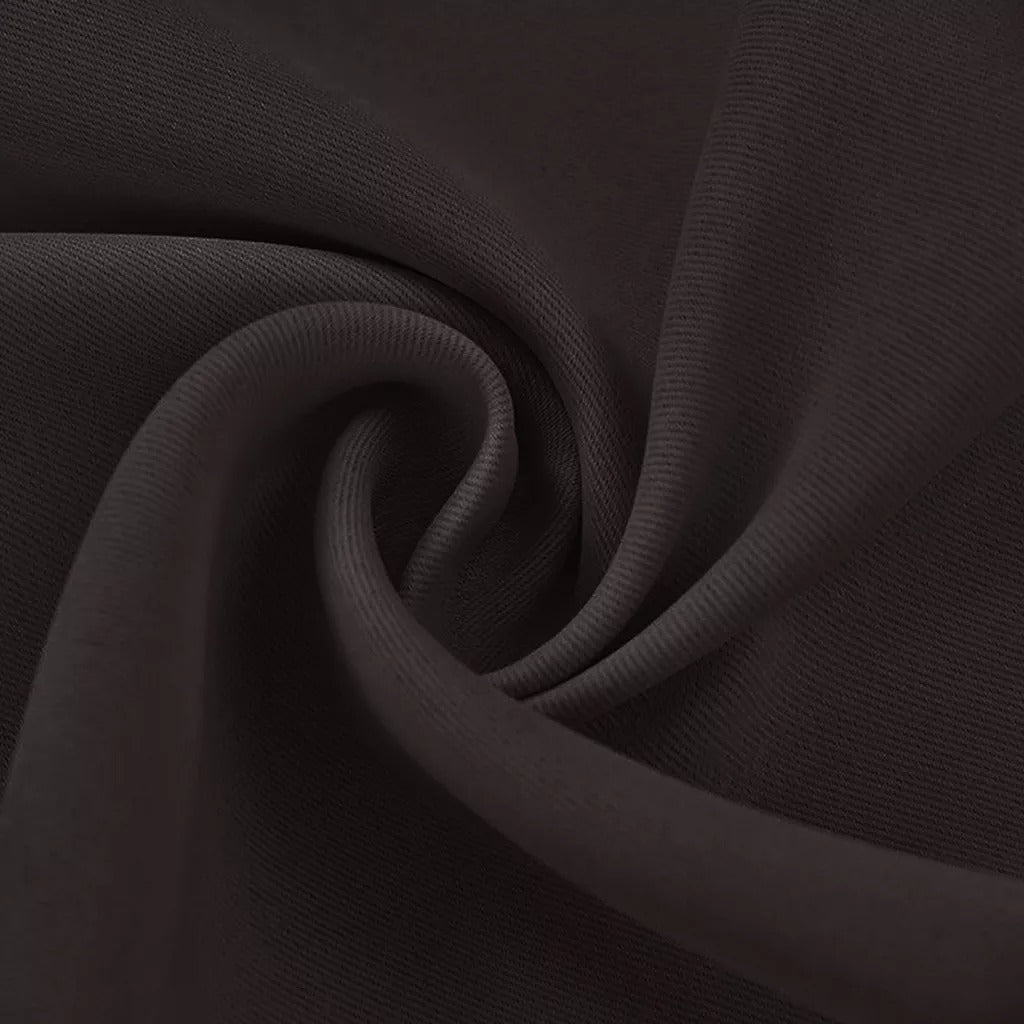 Close-up of black 4-layer soundproof blackout curtain fabric with subtle texture and soft folds for living room or bedroom.