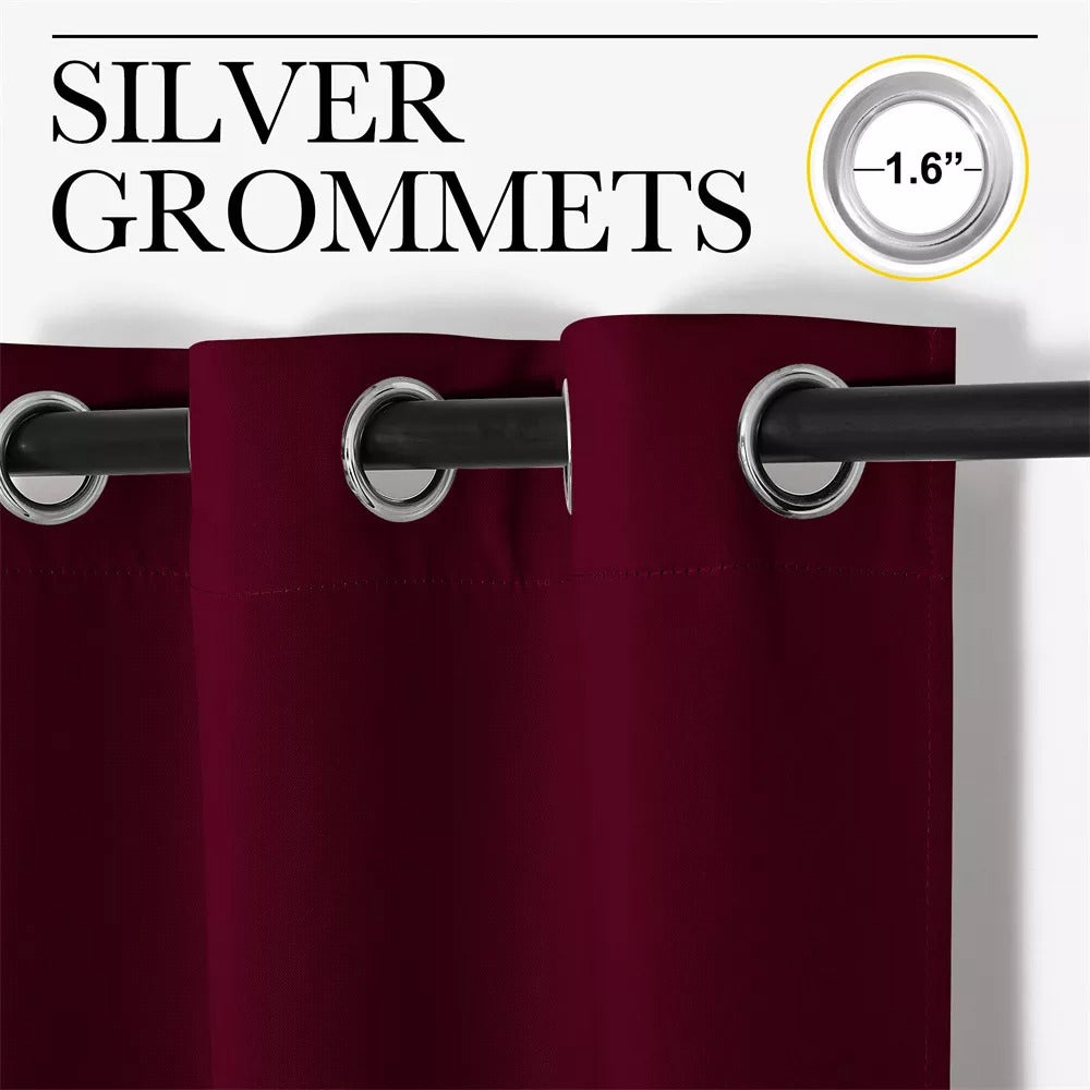 Deep burgundy blackout curtain panel with prominent 1.6-inch silver grommets, hanging on a rod. Ideal for living room or bedroom.
