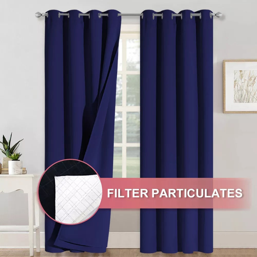 Navy blue 4-layer blackout curtains with silver grommets showing multi-layer fabric for anti-dust & soundproof protection in a living room.