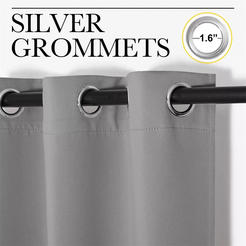 Close-up of grey 4-layer blackout curtain with shiny 1.6-inch silver grommets on a rod for living room or bedroom.