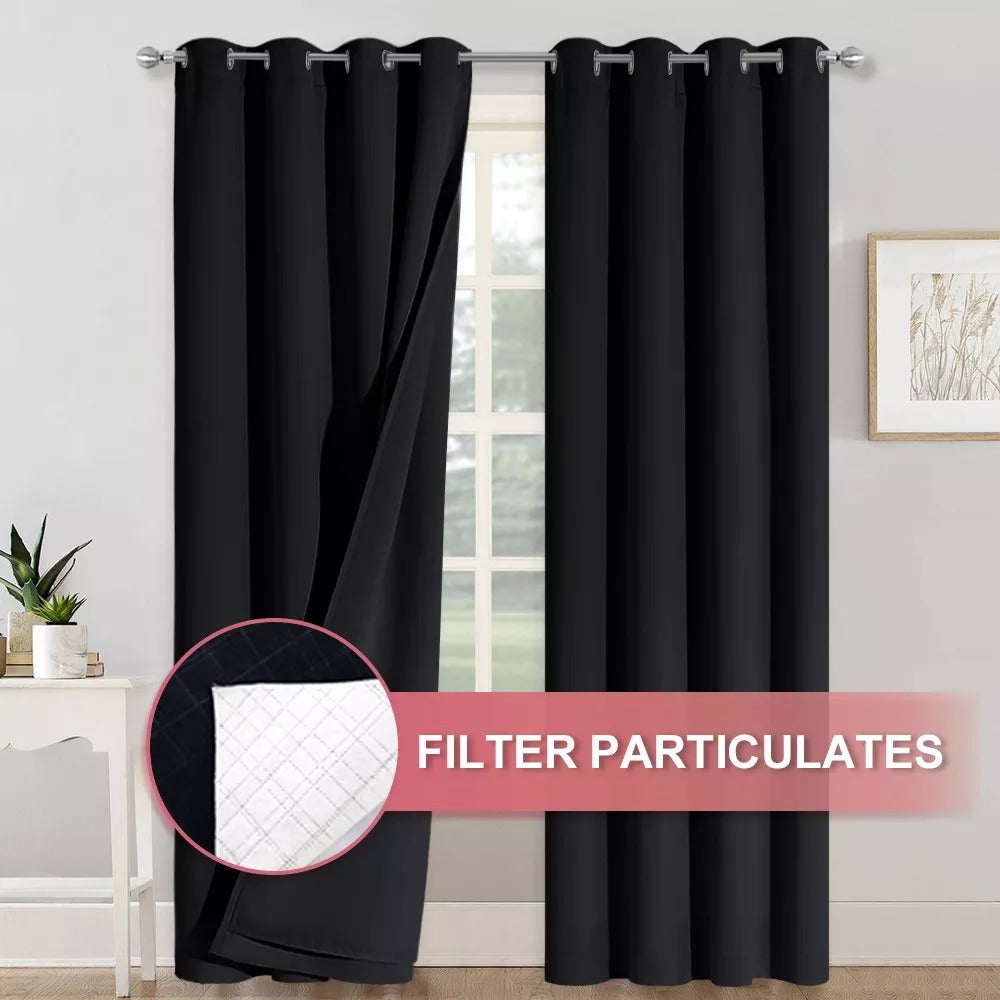 Black 4-layer silver grommet blackout curtains, one panel pulled back to show anti-dust soundproof filter layers for particulate blocking.