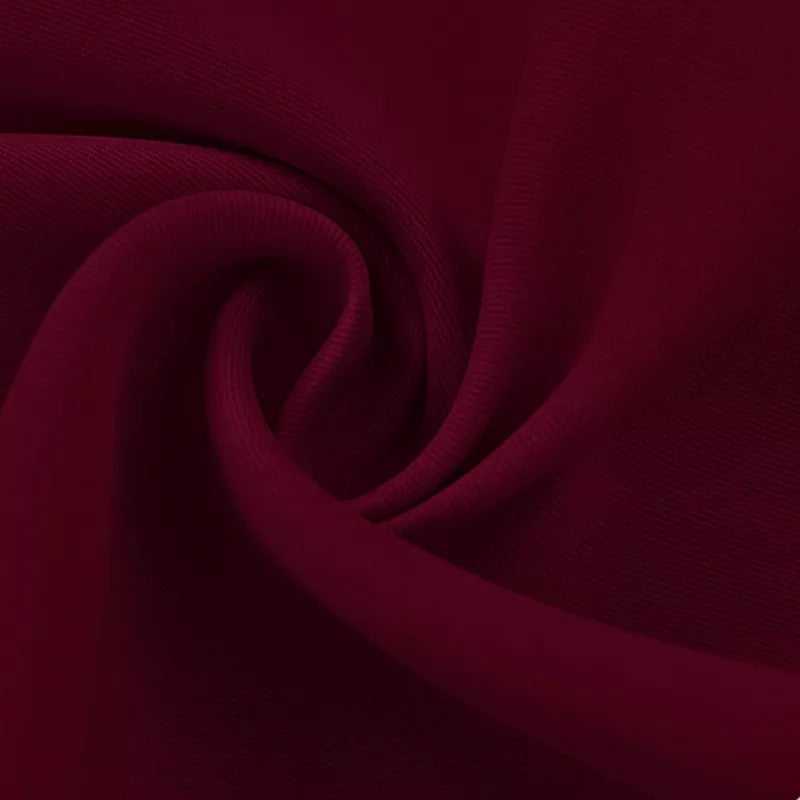 Detailed view of rich burgundy 4-layer blackout curtain fabric, highlighting its smooth, soundproof, and anti-dust texture.