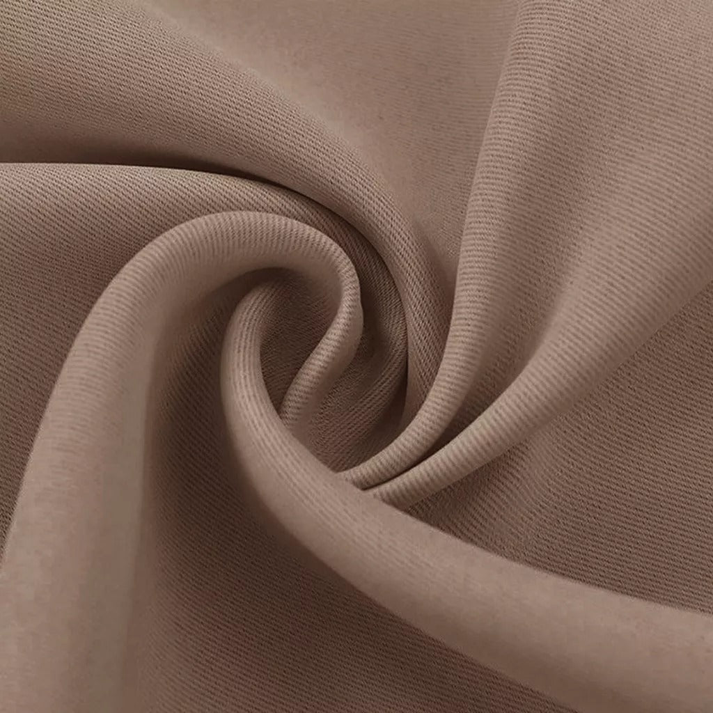 Close-up of textured beige 4-layer blackout curtain fabric, showcasing durable, anti-dust & soundproof material for living rooms.