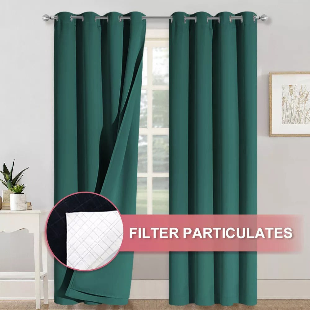Dark green 4-layer blackout curtains with silver grommets, one pulled back showing the anti-dust filter layer for living room/bedroom.