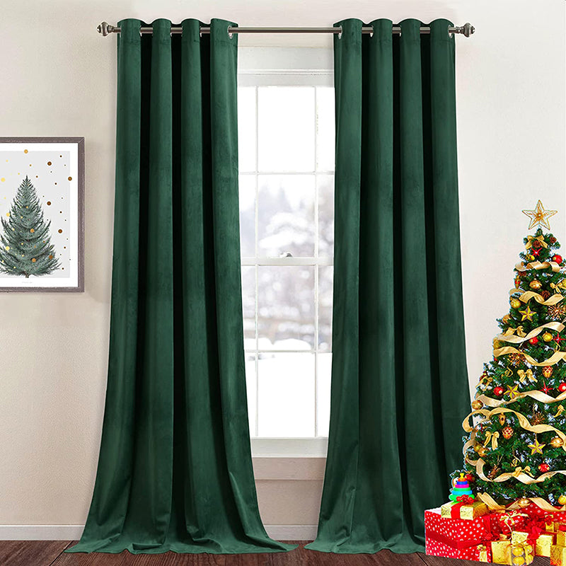 Elegant emerald green velvet blackout curtains (2 panels) with silver grommets, providing warmth and style for a living room or bedroom.