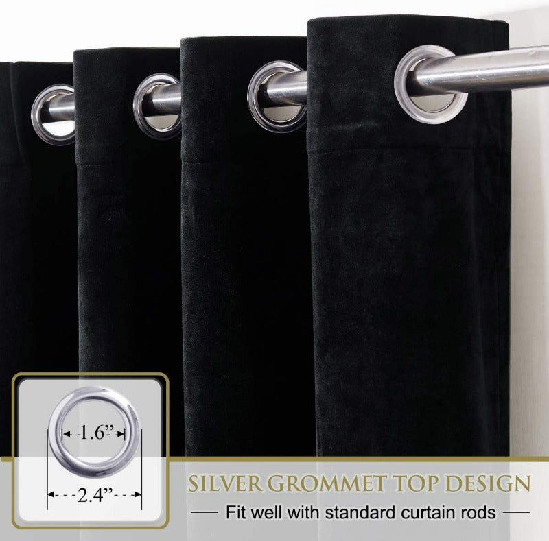 Close-up of luxurious black velvet blackout curtains with silver grommet top, designed to fit standard curtain rods for living rooms & bedrooms.