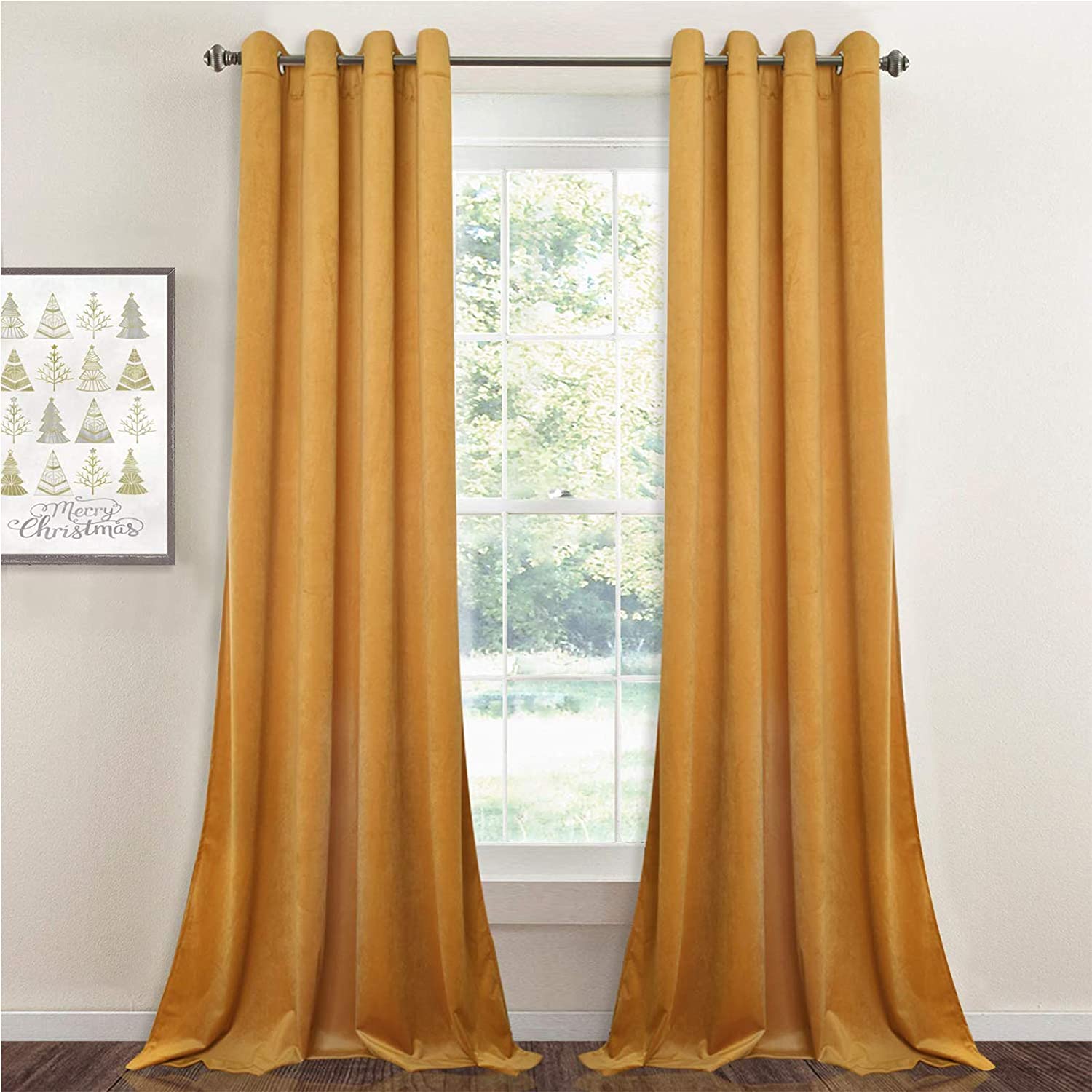 Golden velvet blackout curtain panels with silver grommets, elegantly framing a window, ideal for living room and bedroom privacy.