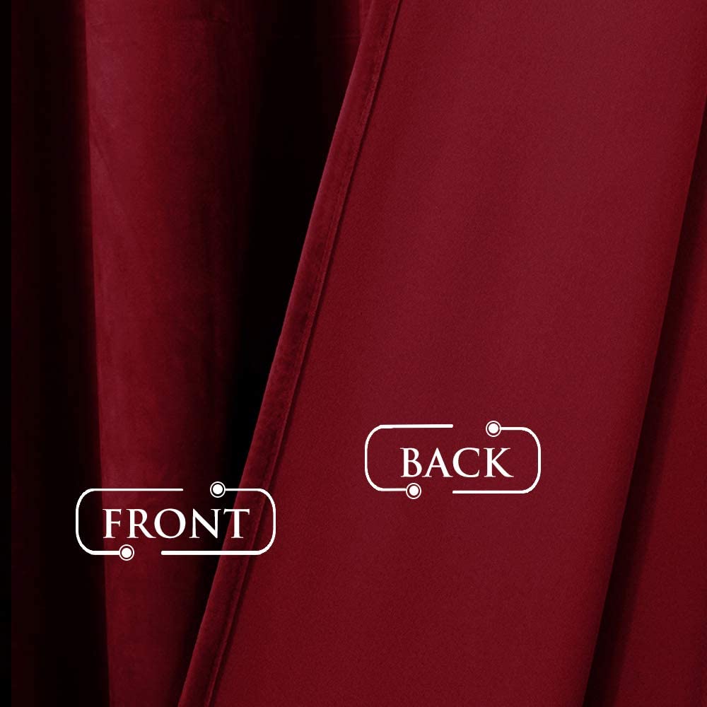 Detailed view of rich maroon velvet blackout curtain fabric, showing the soft, textured front and the smooth, dense light-blocking back.