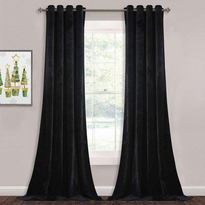Black velvet blackout curtains, two panels with silver grommets, for living room/bedroom, pooling on floor.