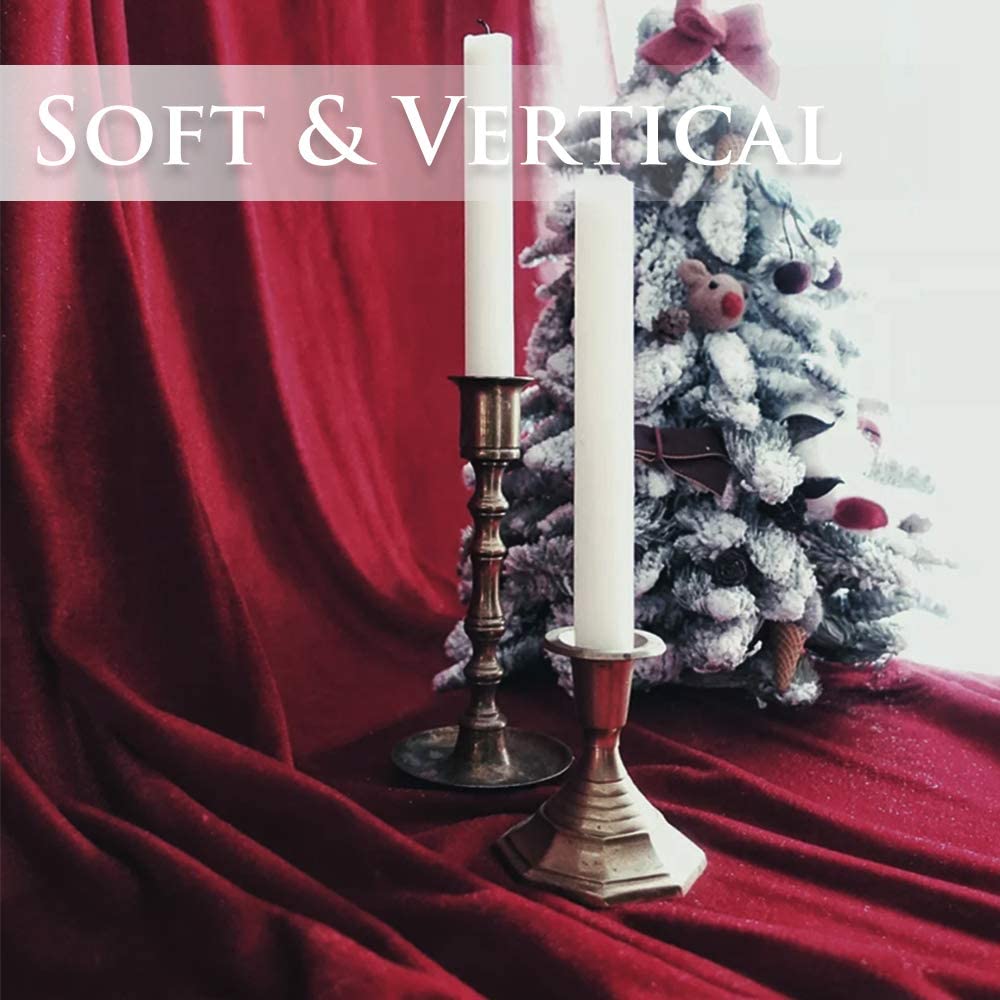 Soft, rich red velvet blackout curtain fabric elegantly draped, highlighting its luxurious texture and perfect vertical fall.