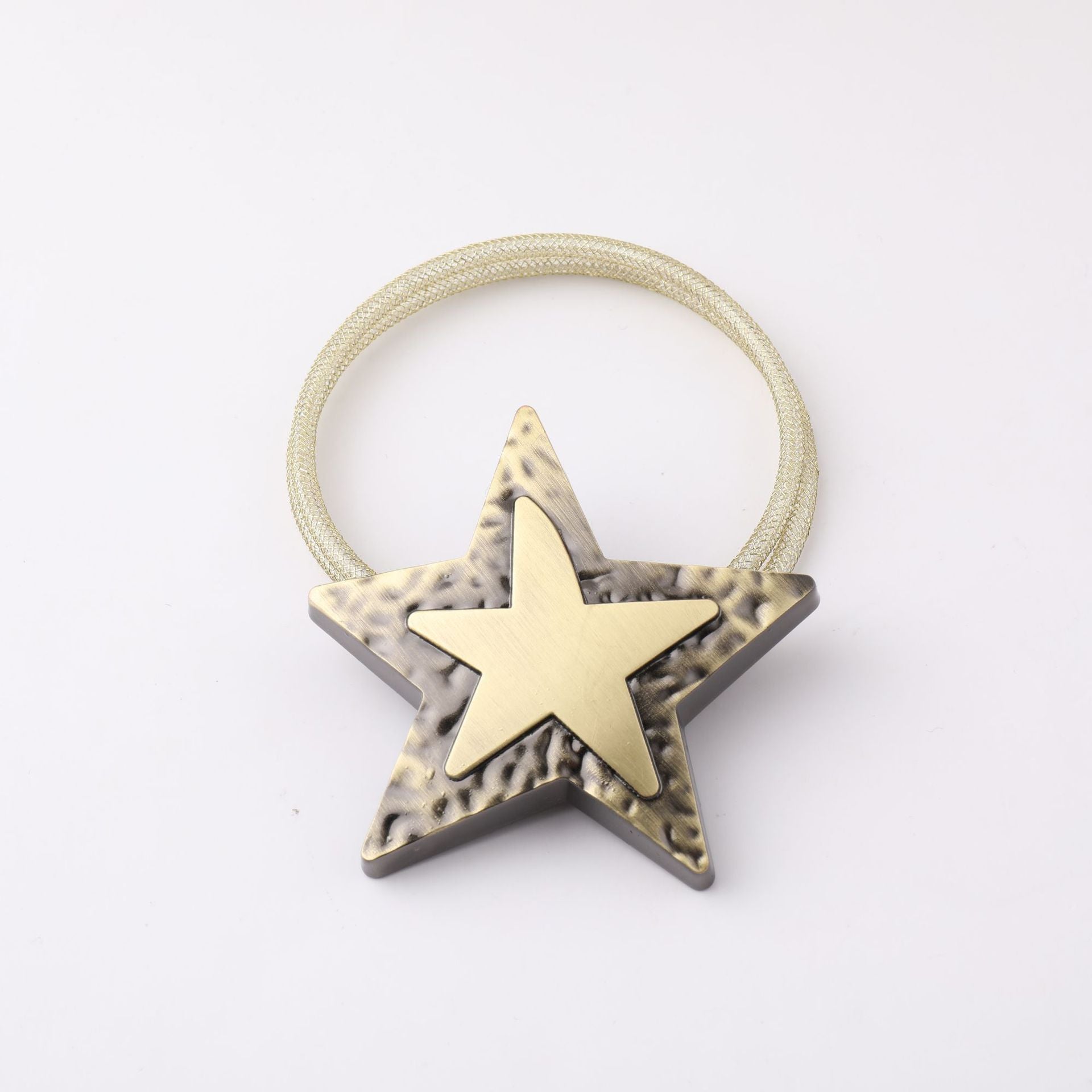 Single gold star metal magnetic curtain tieback with a dark bronze textured star, attached to a sparkling mesh strap.