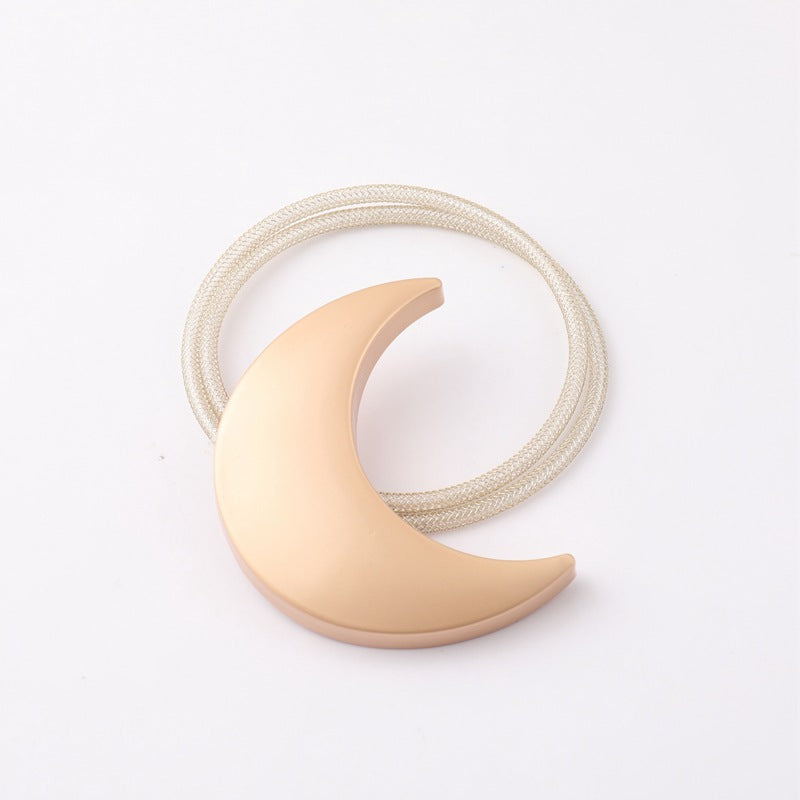 Gold crescent moon metal magnetic curtain tieback with a silver braided strap for outdoor patio & pergola curtains