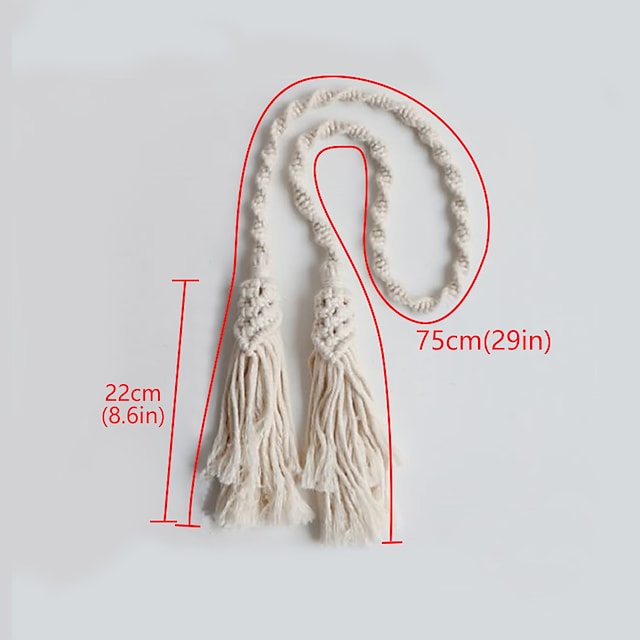 Hand-woven macrame tassel curtain tieback in cream, featuring a braided rope. Total length 75cm, tassel drop 22cm. Window treatment accessory.