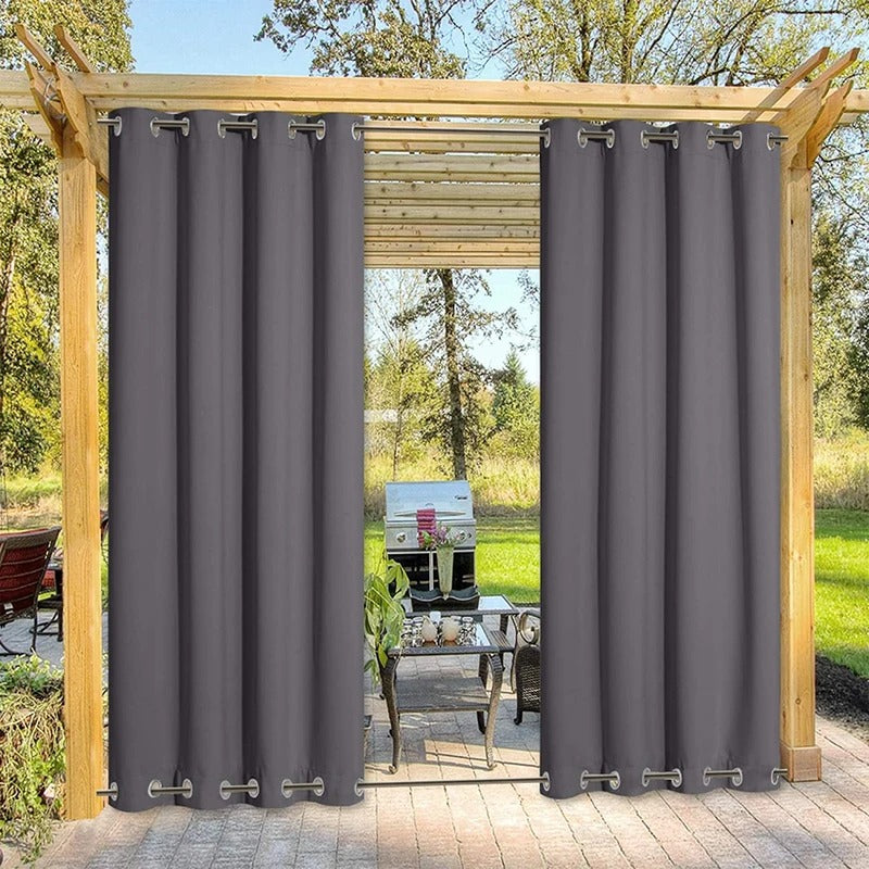 Anthracite top & bottom grommet windproof outdoor curtains installed on a wooden patio pergola, providing privacy and shade.