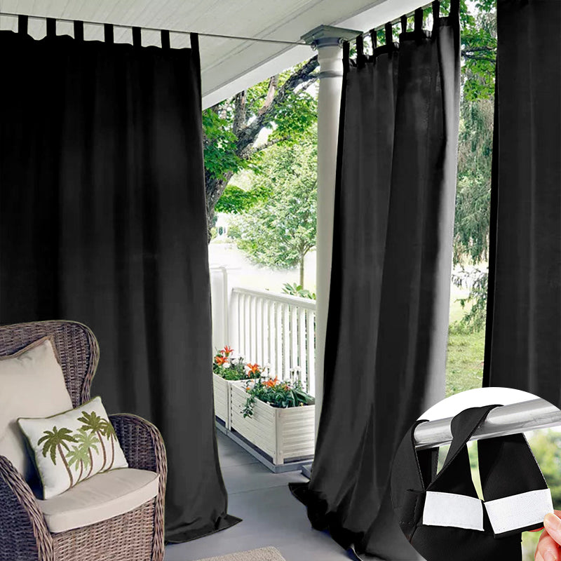 Black Velcro tab top waterproof outdoor curtains on a patio, providing privacy for a wicker chair. Inset shows hook-and-loop tabs.