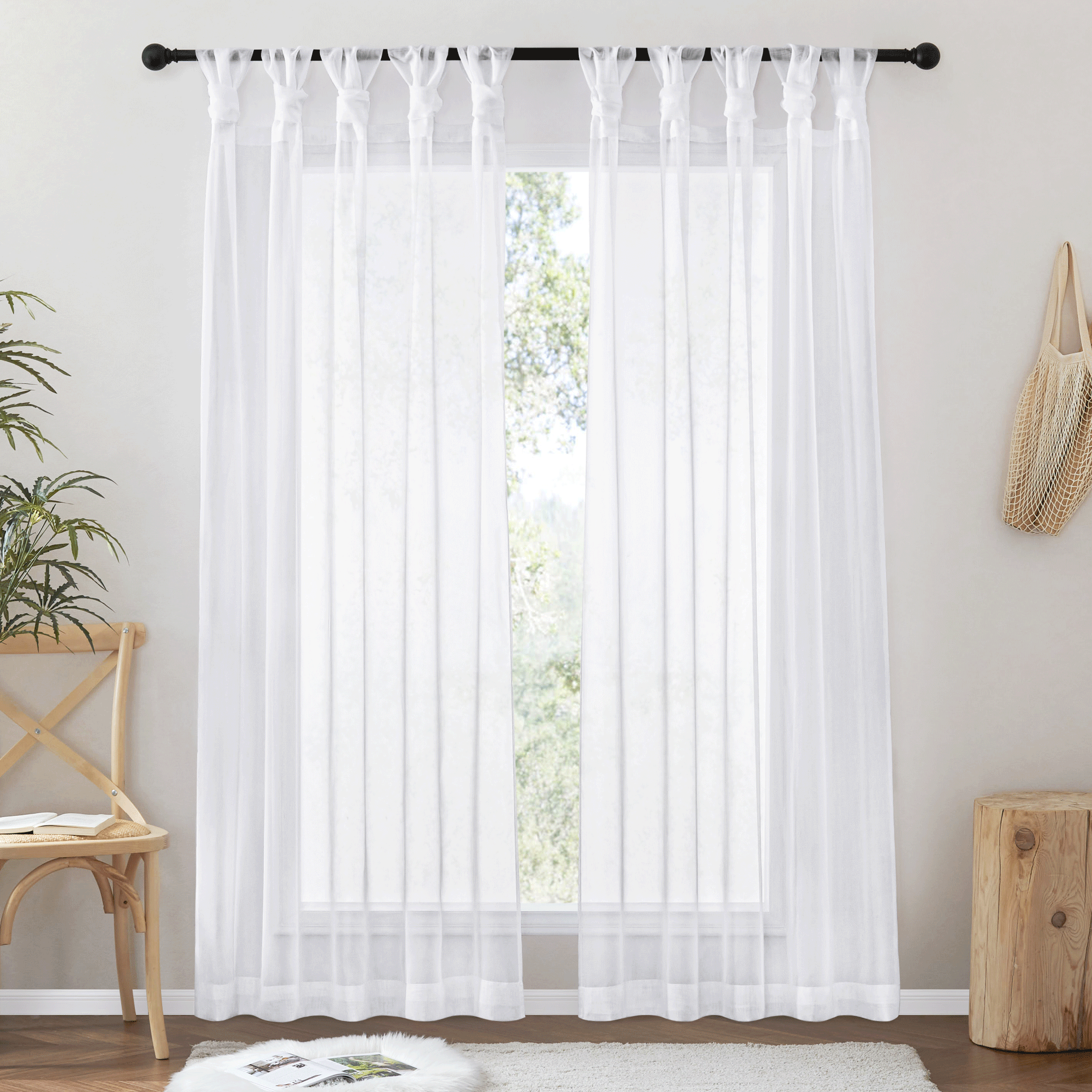 Two white voile sheer privacy curtains with twist tab top header on a window, perfect for bedroom or living room light filtering.
