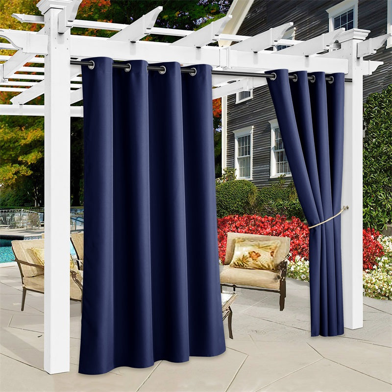 Dark blue waterproof outdoor canvas curtains on a white pergola. Three panels fully closed, one tied back for patio privacy & sun protection.