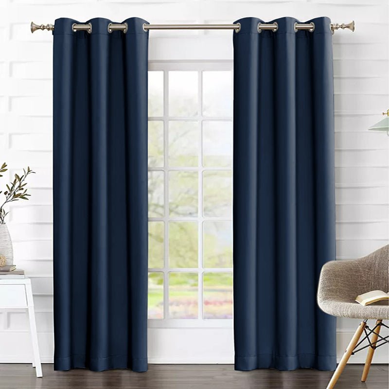 Dark blue thermal insulated blackout weave curtains with grommets, displayed as two panels in a modern living room setting.